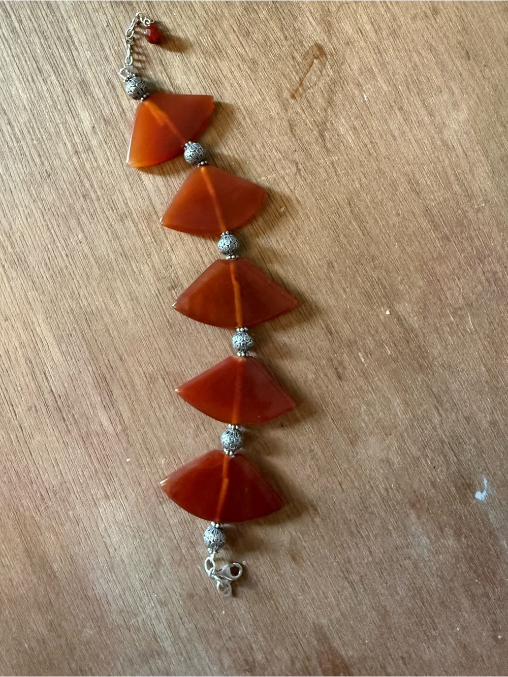 carnelian or red agate translucent, fan-shaped) stones with silver hardware